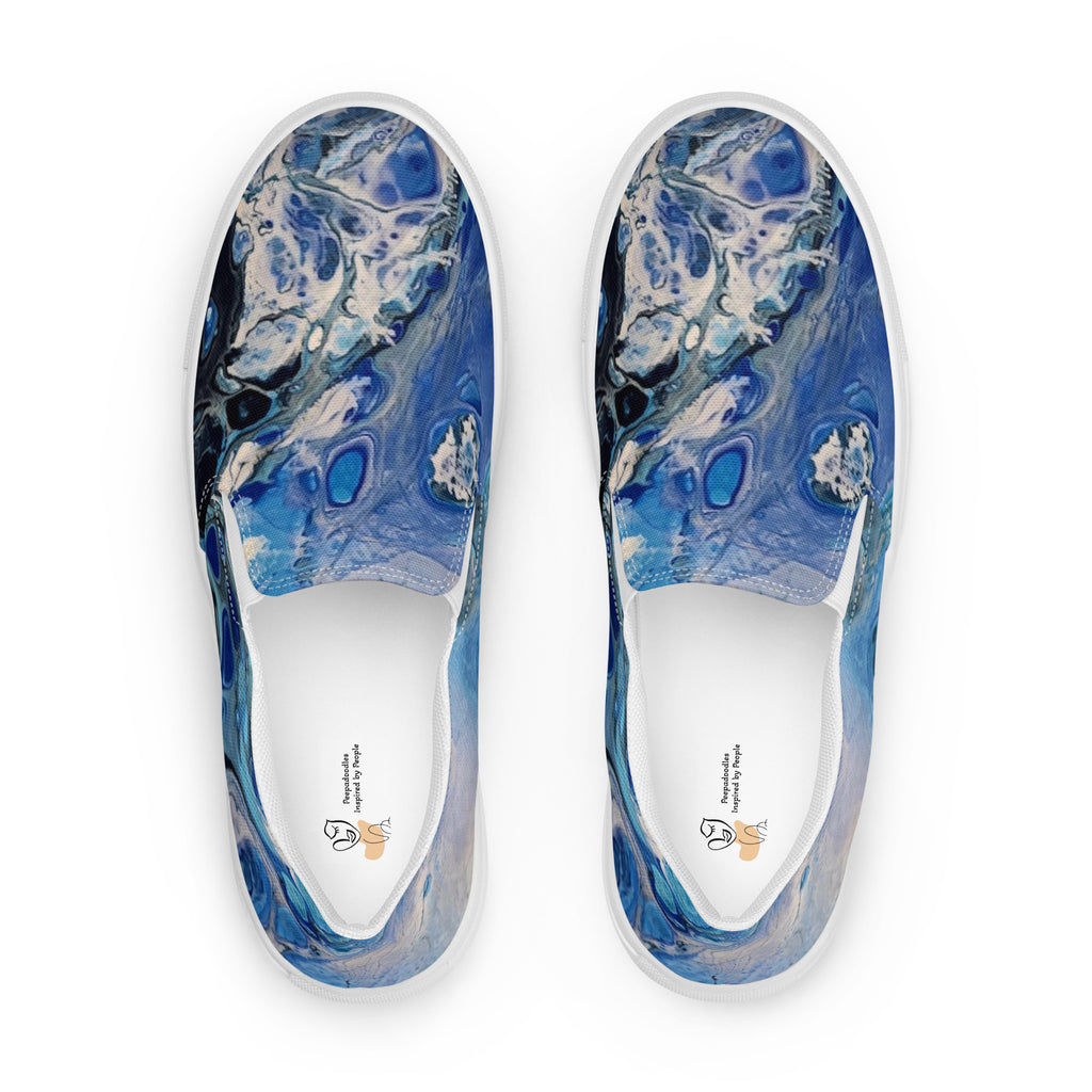 Blue marbled slip-on shoes on a white background