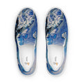 Blue marbled slip-on shoes on a white background