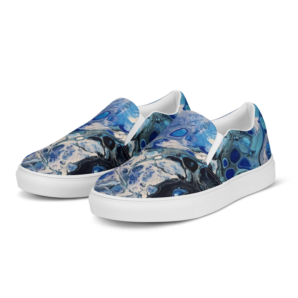 Blue marbled slip-on shoes on a white background