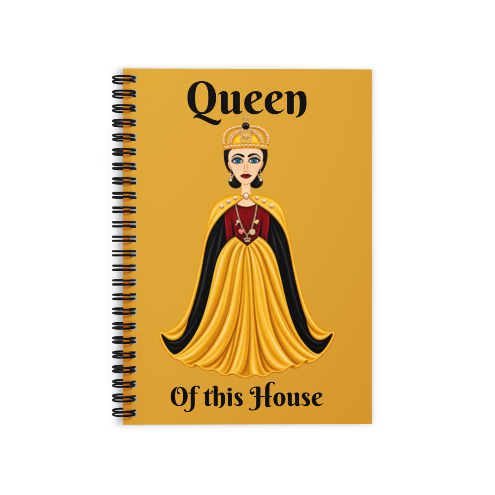 A gold notebook that is royalty themed with a queen on the cover