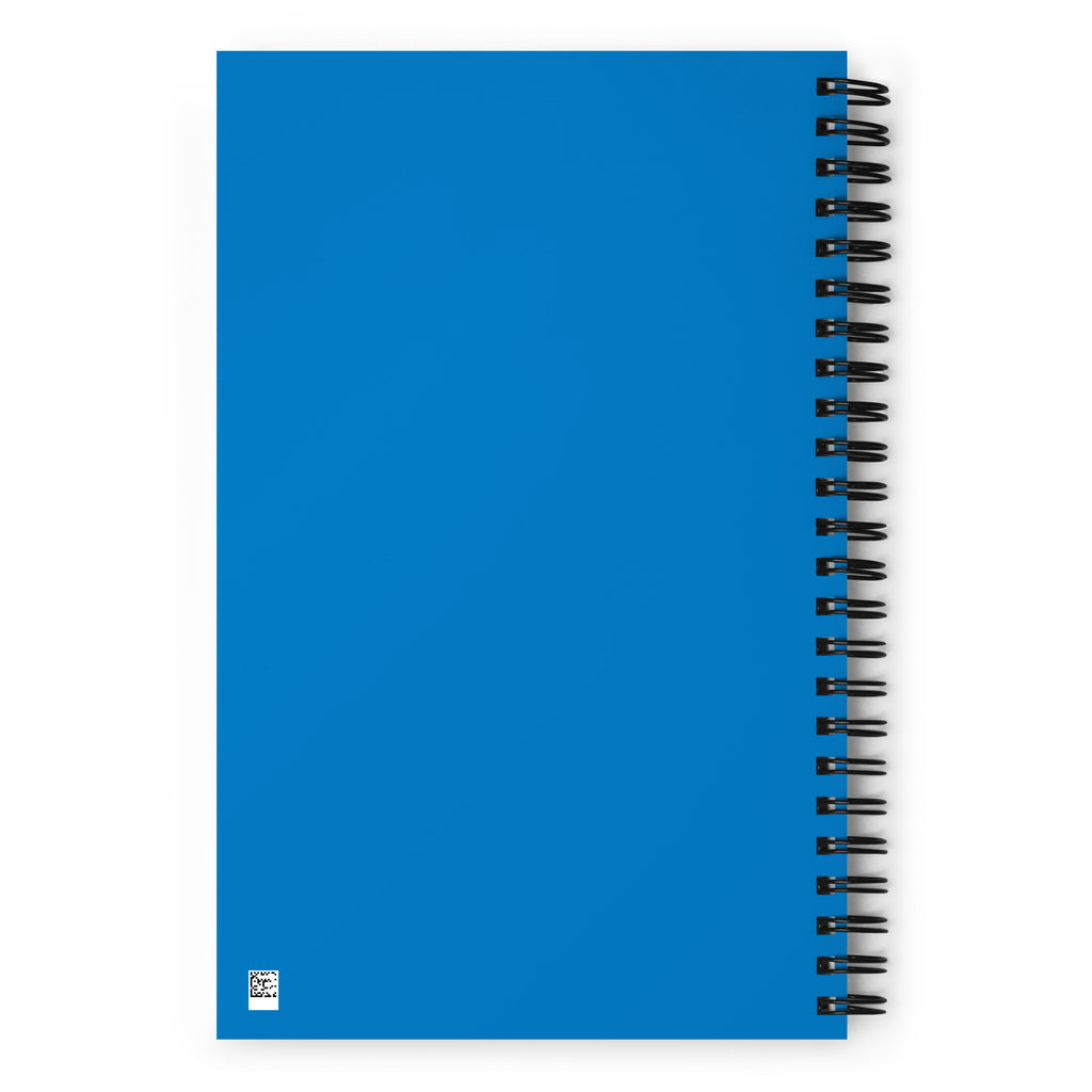 Blue notebook with black spiral binding on a white background