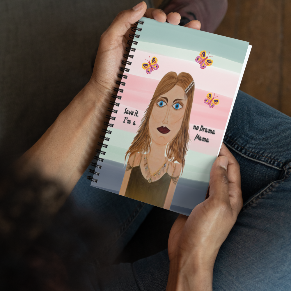 Notebook with a personalized illustration of a woman on the cover held by a person.