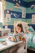 A spiral-bound notebook featuring a cartoon mermaid with a gold tail and shell top, surrounded by blue whales and coral on a white background, with the text 'Mermaid Vibes Only' printed above.