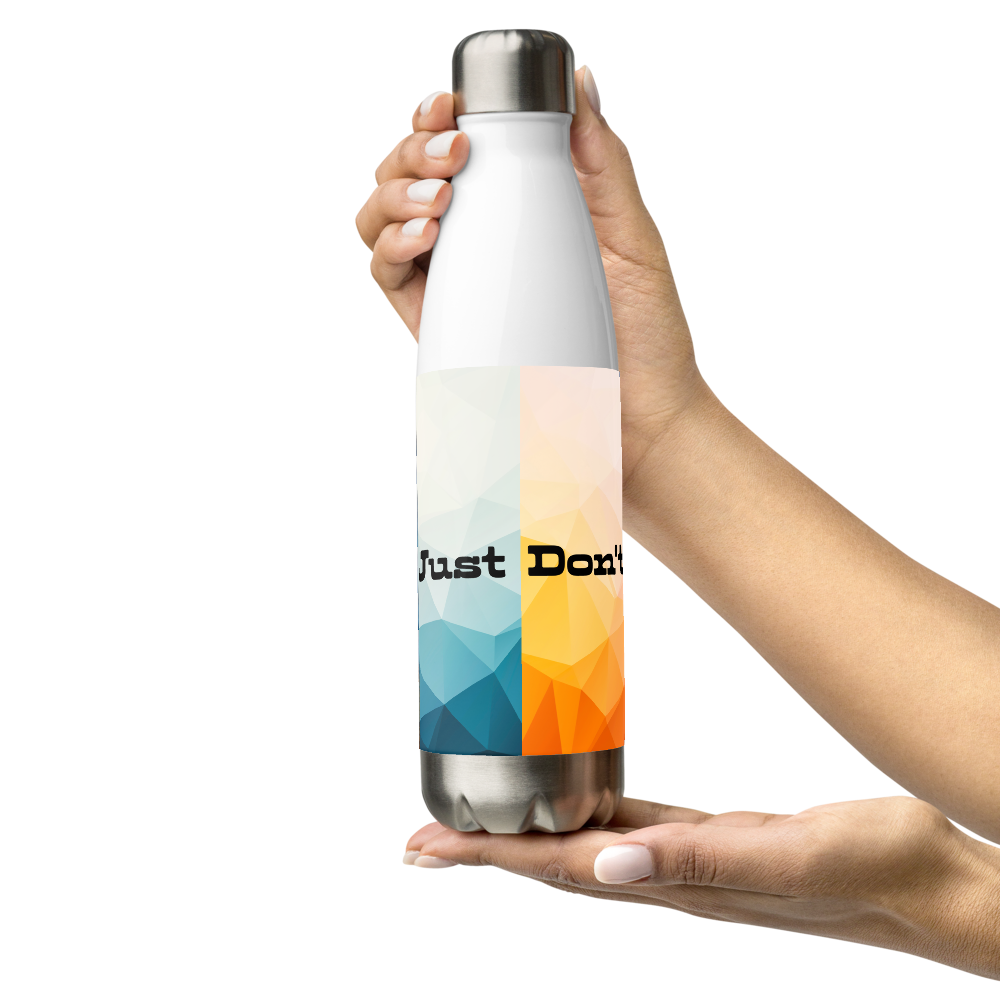 A white insulated water bottle with a silver metal cap and base, held by two hands against a solid white background. The bottle features a colorful geometric pattern in blue, orange, and yellow, with the text 'Just Don't' printed across the center.