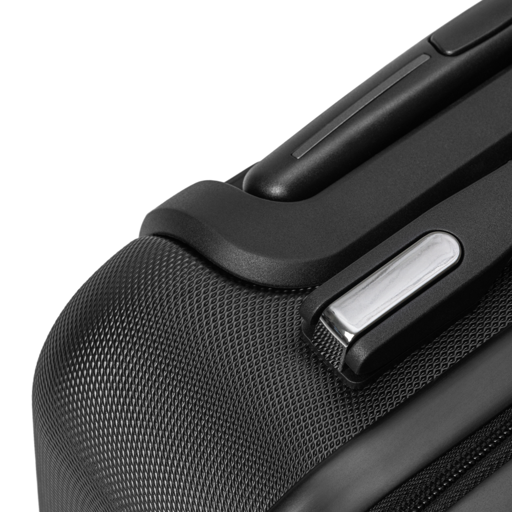 Close-up of a black suitcase handle on a white background
