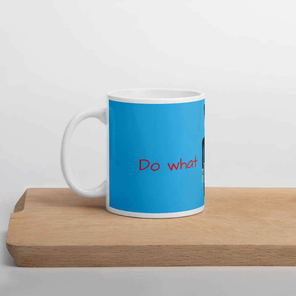 Blue mug with red text 'Do what' on a wooden surface