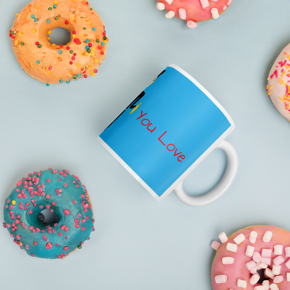 Blue mug with 'You Love' text on a light blue background with colorful donuts.