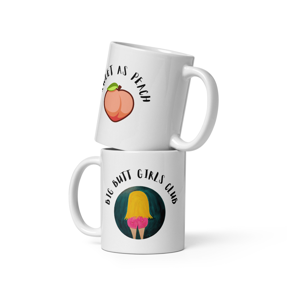 Two white mugs with graphic designs and text on a white background
