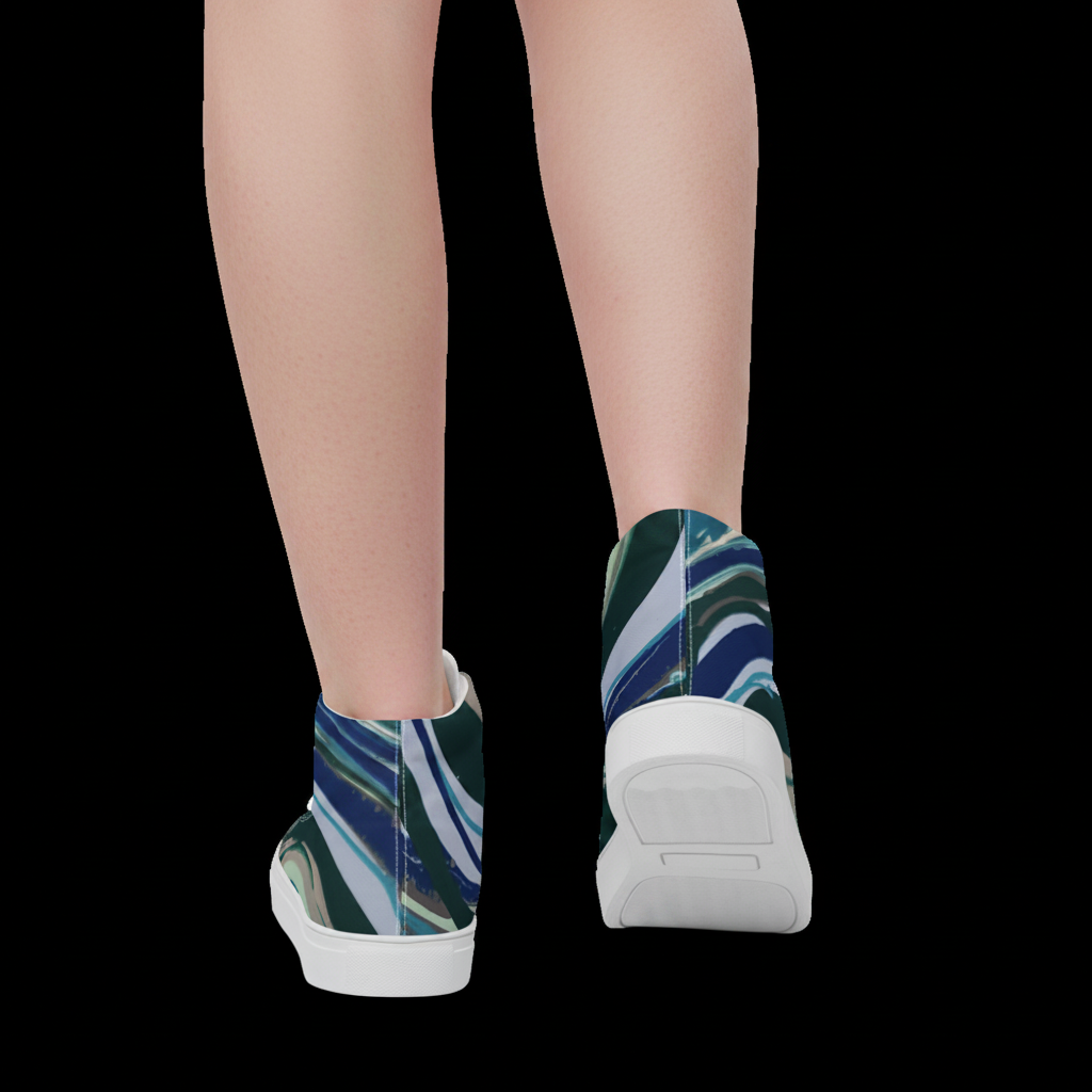 White sneakers with blue and green pattern worn by a person on a white background