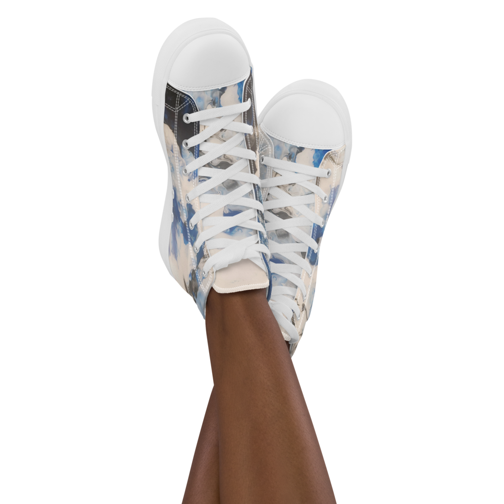 White sneakers with blue and beige pattern worn by a person on a white background