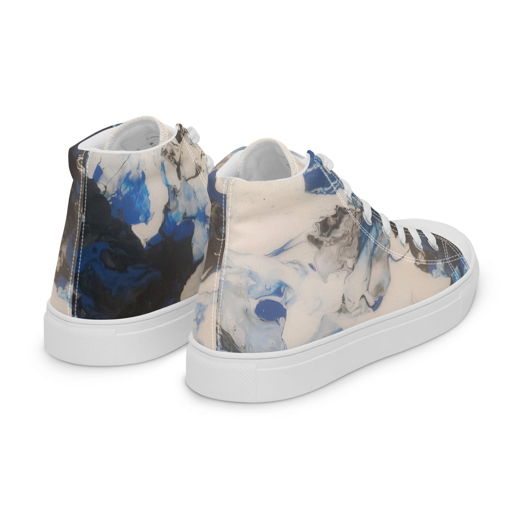 Pair of high-top sneakers with abstract blue and black design on a white background
