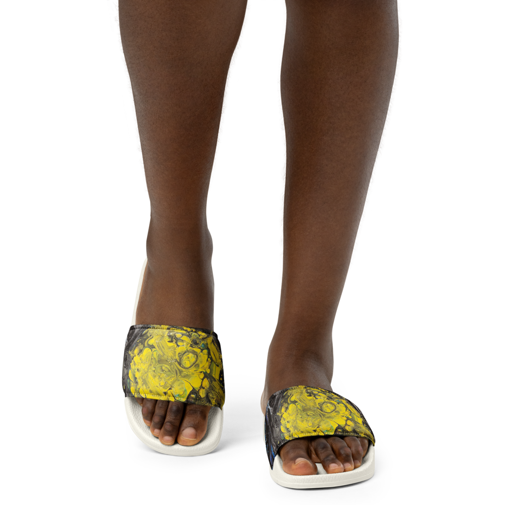 Person wearing yellow and black patterned sandals on a white background