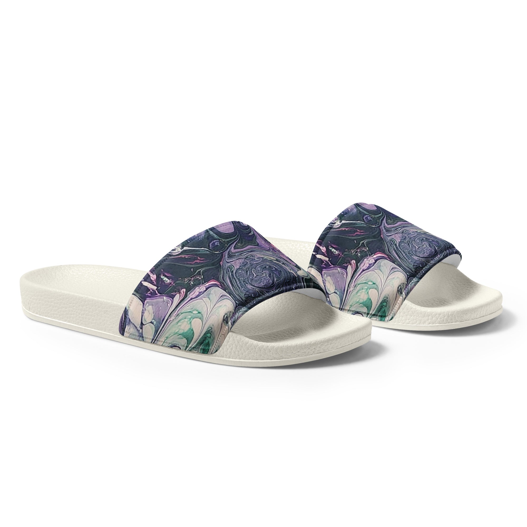 Pair of white slides with purple and blue marbled straps on a light gray background