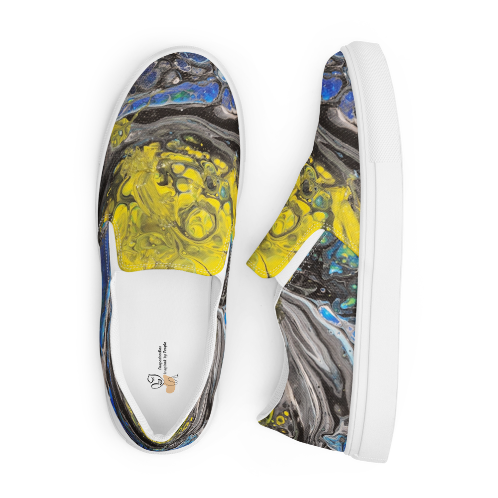 White slip-on shoes with abstract yellow and gray design on a white background