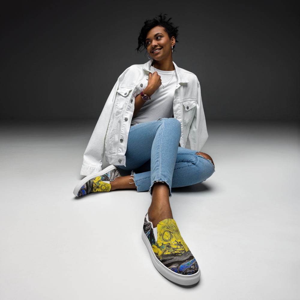 Person wearing colorful sneakers with a plain background