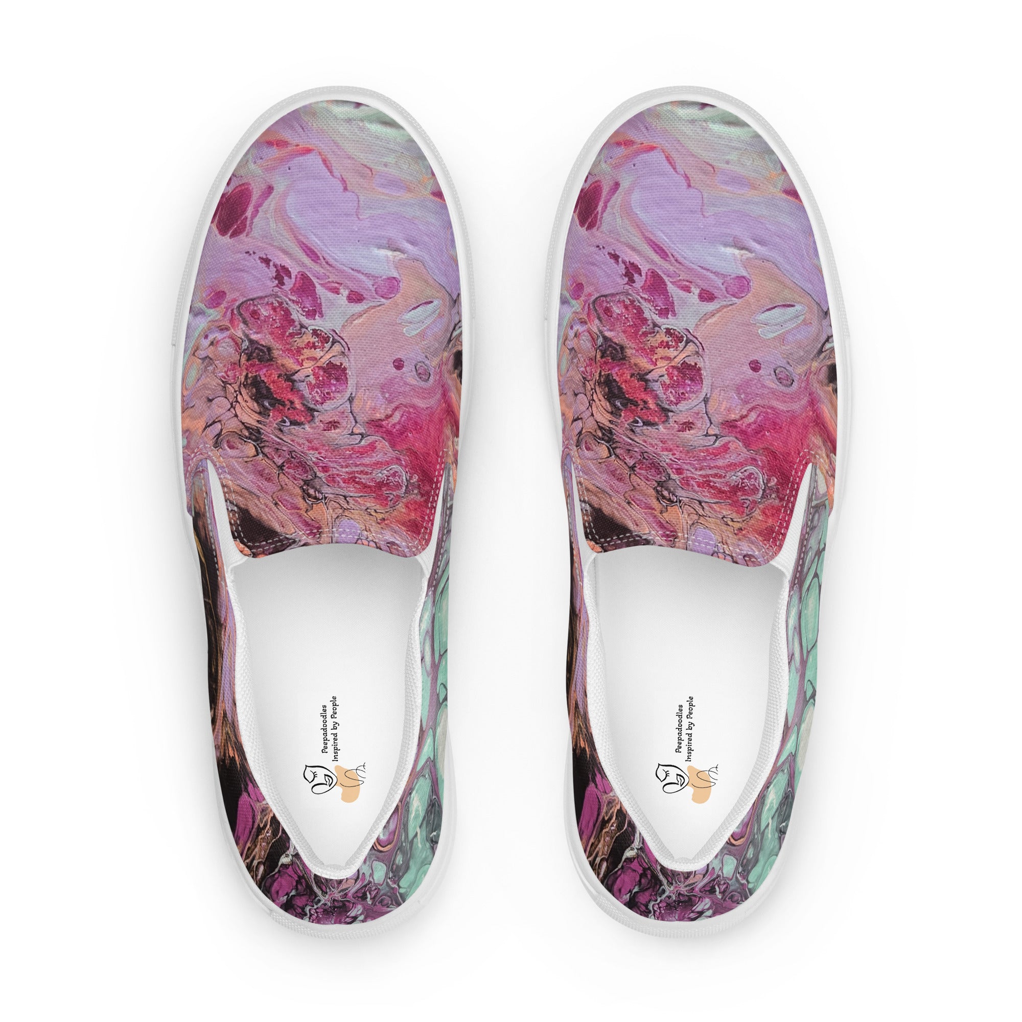Pair of slip-on shoes with colorful abstract design on a white background