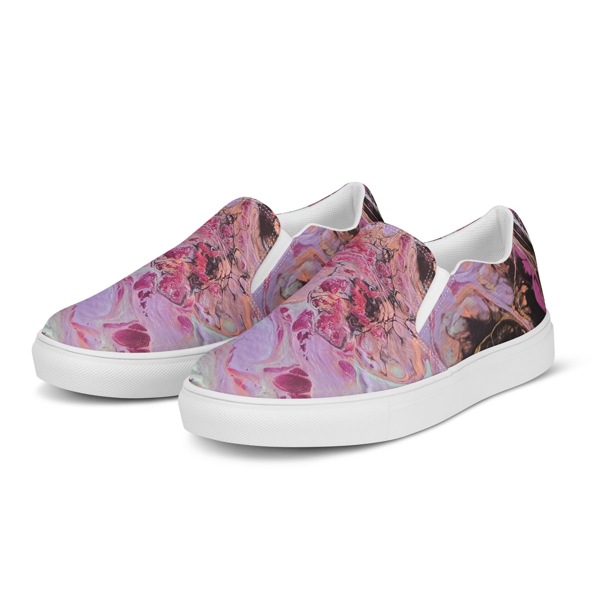 Pair of slip-on shoes with colorful abstract design on a white background